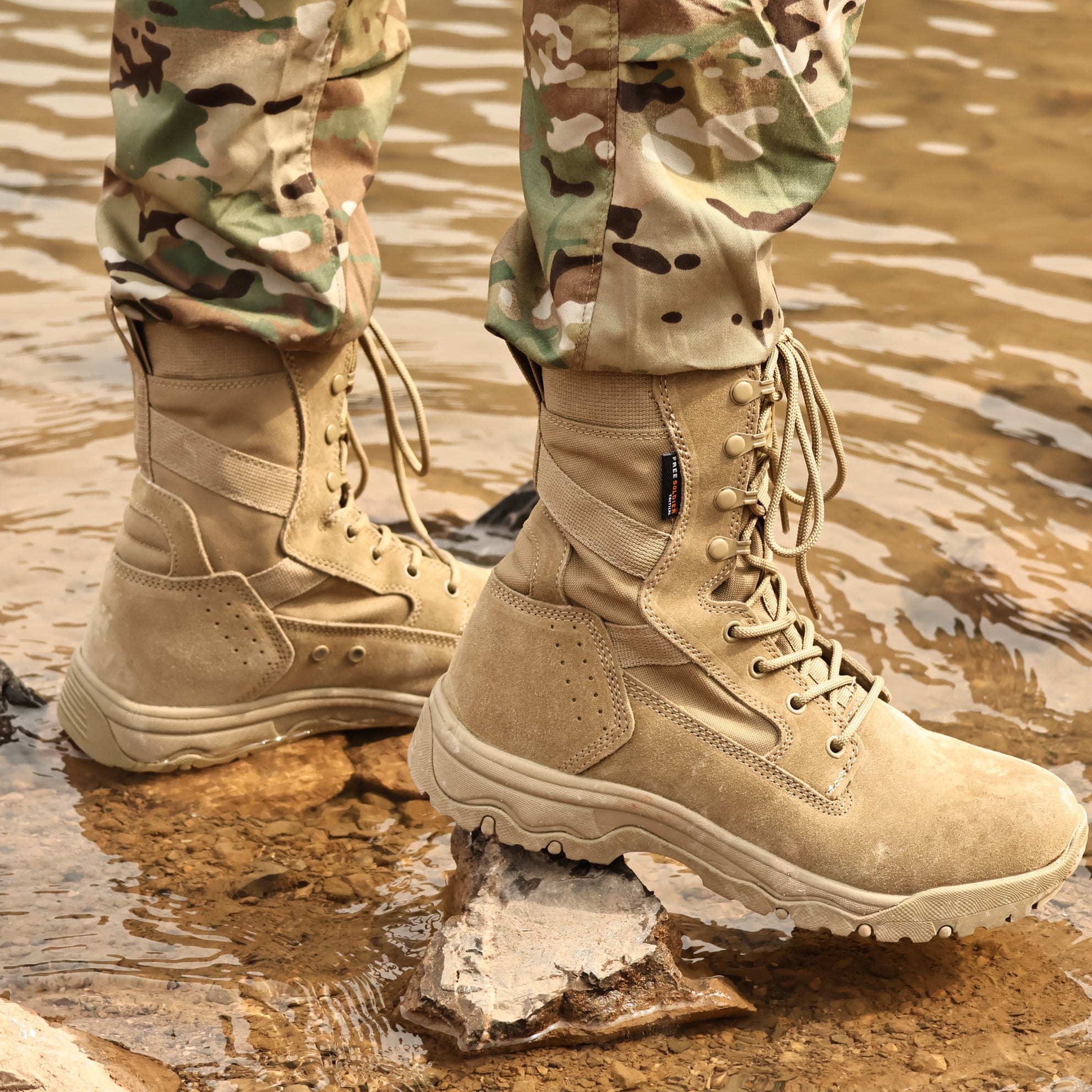 Lower body wearing camouflage pants and tan 8-inch tactical boots, highlighting the boots' tactical features