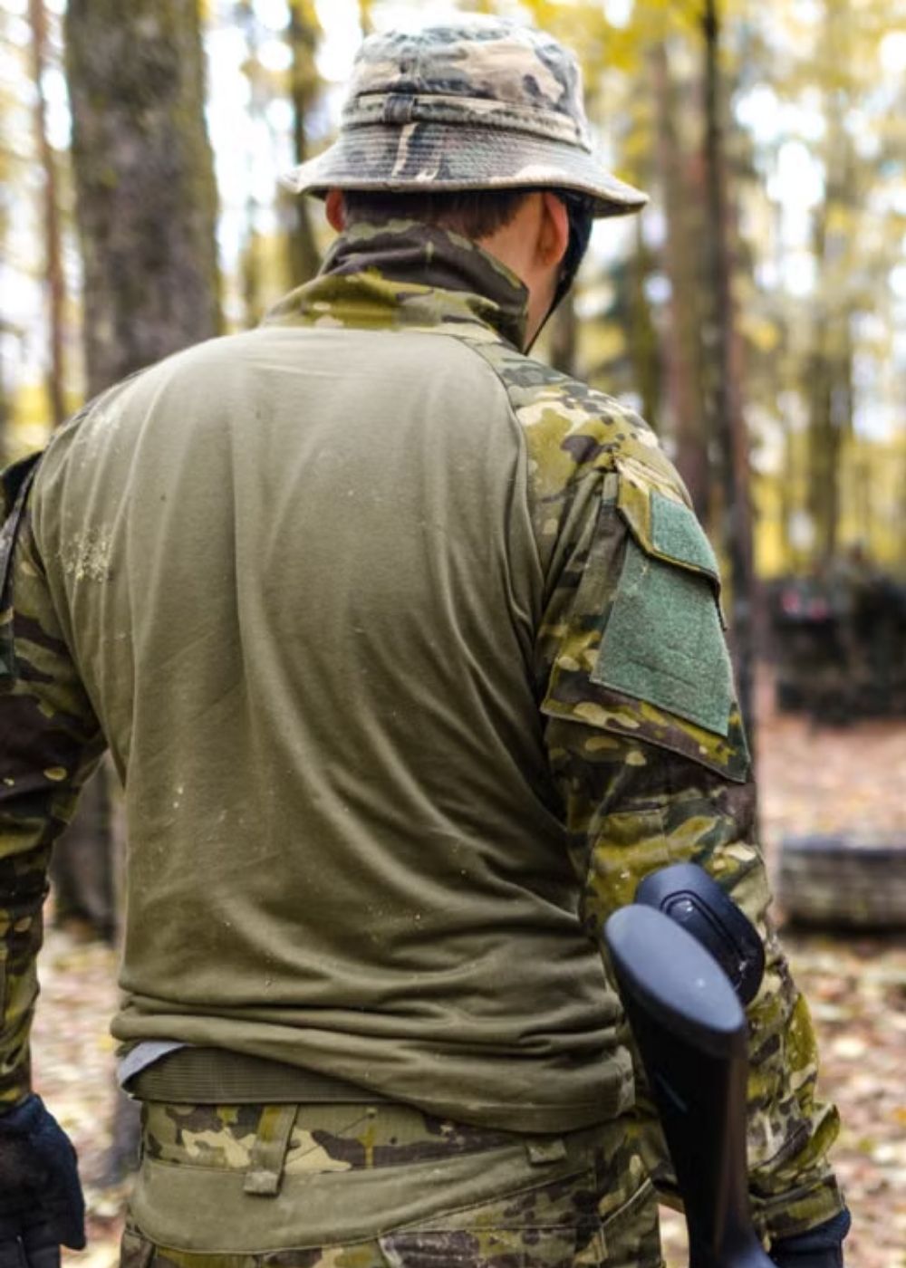 Person wearing a camouflage training uniform viewed from behind